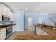 Spacious kitchen with granite countertops, stainless steel appliances, and white cabinetry at 7911 Hampton Lake Dr, Tampa, FL 33647