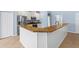 Kitchen featuring granite countertops, a kitchen bar, and stainless appliances at 7911 Hampton Lake Dr, Tampa, FL 33647