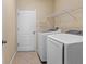 The clean laundry room has both a washer and dryer for your convenience at 7911 Hampton Lake Dr, Tampa, FL 33647