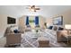 Cozy living room with neutral decor, plush seating, and a ceiling fan for added comfort at 7911 Hampton Lake Dr, Tampa, FL 33647