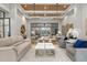 Community lounge featuring sofas, accent chairs, stylish decor, and a decorative ceiling at 7911 Hampton Lake Dr, Tampa, FL 33647