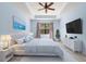 Tranquil main bedroom features neutral walls, a tray ceiling, and soft, plush carpeting at 7911 Hampton Lake Dr, Tampa, FL 33647