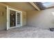 This tile patio offers access into the home via a set of sliding glass doors at 7911 Hampton Lake Dr, Tampa, FL 33647