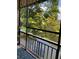 Relaxing balcony with retractable screens for serene water and tree views at 7951 58Th N Ave # 308, St Petersburg, FL 33709