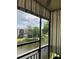 Balcony scene showing waterfront view and relaxing retractable shade feature at 7951 58Th N Ave # 308, St Petersburg, FL 33709