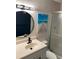 Bathroom features modern matte black fixtures, vanity and a shower behind glass doors at 7951 58Th N Ave # 308, St Petersburg, FL 33709