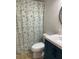 Bathroom featuring a modern vanity, starfish shower curtain, and a bright, clean aesthetic at 7951 58Th N Ave # 308, St Petersburg, FL 33709