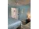 Inviting bedroom with two beds, a nightstand, and a door leading to more living space at 7951 58Th N Ave # 308, St Petersburg, FL 33709