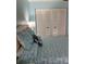 Bedroom with large white closet doors and a comfortable bed with decorative pillows at 7951 58Th N Ave # 308, St Petersburg, FL 33709