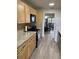 Well-equipped kitchen with stainless steel appliances, light wood cabinets, and granite countertops at 7951 58Th N Ave # 308, St Petersburg, FL 33709