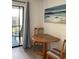Cozy lanai featuring sliding glass doors, a table for two, and views of the surrounding area at 7951 58Th N Ave # 308, St Petersburg, FL 33709