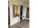 Interior of laundry area with ironing board attached to the wall cabinet and closet at 7951 58Th N Ave # 308, St Petersburg, FL 33709