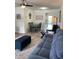 Inviting living room features modern furnishings, neutral paint, and seamlessly flows into a cozy dining area at 7951 58Th N Ave # 308, St Petersburg, FL 33709