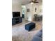 This living room boasts new floors, an open floor plan, and seamless access to a stylish bathroom and dining area at 7951 58Th N Ave # 308, St Petersburg, FL 33709
