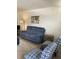 This comfortable living room features a plush sofa, stylish chairs and lighting, and neutral colored floors at 7951 58Th N Ave # 308, St Petersburg, FL 33709