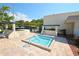 Bright image of a sparkling in-ground pool surrounded by a patio and some lounge chairs at 7951 58Th N Ave # 308, St Petersburg, FL 33709