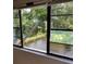 Inviting scene from windows overlooking the canal and mature tree landscaping at 7951 58Th N Ave # 308, St Petersburg, FL 33709