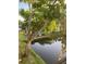 Scenic view of the water with mature trees creating a picturesque and peaceful backdrop at 7951 58Th N Ave # 308, St Petersburg, FL 33709