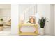 Bright entryway with a decorated accent table and stairway in the background at 9352 Cannon Beach Dr, Parrish, FL 34219