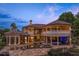 Luxury home showcasing a pool, spa, covered patio, and manicured outdoor living space at 1102 Merry Water Dr, Lutz, FL 33548