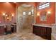 Stunning bathroom featuring a custom shower, dual vanities, and decorative mirrors at 1102 Merry Water Dr, Lutz, FL 33548