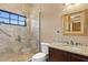 Elegant bathroom featuring a glass shower, granite countertop, and dark wood vanity at 1102 Merry Water Dr, Lutz, FL 33548