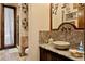 Elegant bathroom featuring a vessel sink, granite countertop, and decorative accents at 1102 Merry Water Dr, Lutz, FL 33548