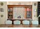 Dining room with custom wood cabinets with marble countertop and decorative mirror art at 1102 Merry Water Dr, Lutz, FL 33548