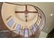 Grand foyer showcasing a spiral staircase, brick ceiling, chandelier, and arched windows at 1102 Merry Water Dr, Lutz, FL 33548