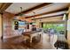 Spacious game room with pool table, built-in cabinets, and access to an outdoor patio with beautiful views at 1102 Merry Water Dr, Lutz, FL 33548