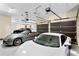 Spacious three-car garage featuring a clean, epoxy-coated floor and ample storage at 1102 Merry Water Dr, Lutz, FL 33548