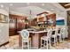 Gourmet kitchen featuring a center island with seating, stainless steel appliances, and custom cabinets at 1102 Merry Water Dr, Lutz, FL 33548