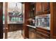 Gourmet kitchen with custom cabinets, built-in coffee maker, and open access to the dining area at 1102 Merry Water Dr, Lutz, FL 33548