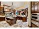 Spacious kitchen featuring granite countertops, custom cabinets, and stainless steel appliances at 1102 Merry Water Dr, Lutz, FL 33548