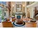 Elegant living room showcasing a fireplace, high ceilings, and refined decor at 1102 Merry Water Dr, Lutz, FL 33548