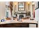 Stylish living room featuring stone fireplace, granite topped wet bar, and comfortable seating at 1102 Merry Water Dr, Lutz, FL 33548