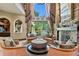Elegant living room featuring a fireplace, high ceilings, and a picturesque view of the outdoors at 1102 Merry Water Dr, Lutz, FL 33548