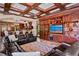 Spacious living room featuring coffered ceilings, custom wood built-ins and fireplace at 1102 Merry Water Dr, Lutz, FL 33548