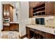 Home office features built-in cabinets, desk, granite countertops, and stainless steel appliances at 1102 Merry Water Dr, Lutz, FL 33548