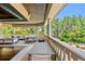Inviting outdoor seating area with multiple tables and chairs, perfect for entertaining and enjoying the view at 1102 Merry Water Dr, Lutz, FL 33548