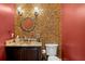 Elegant powder room featuring mosaic tile wall, granite countertop, and decorative lighting fixtures at 1102 Merry Water Dr, Lutz, FL 33548