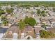 Aerial view of a residential neighborhood showcasing well-maintained homes and lush greenery at 11318 Stoneybrook Path, Port Richey, FL 34668