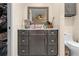 The bathroom features a vanity with storage and a mirror, offering functionality and style at 11318 Stoneybrook Path, Port Richey, FL 34668