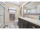 Bathroom boasts a well-lit vanity, framed mirror, and ample counter space at 11318 Stoneybrook Path, Port Richey, FL 34668
