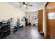 Bedroom features a ceiling fan, tile floors and a window providing natural light at 11318 Stoneybrook Path, Port Richey, FL 34668