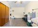 Bedroom features tile floors, a closet and neutral colored walls at 11318 Stoneybrook Path, Port Richey, FL 34668