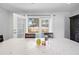 Bright dining room features tile flooring, natural light, and direct access to the outdoor swimming pool at 11318 Stoneybrook Path, Port Richey, FL 34668
