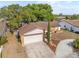 Aerial view of a single-story house with a two-car garage and front yard at 11318 Stoneybrook Path, Port Richey, FL 34668