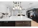 Bright kitchen with a large island, modern appliances, and stylish pendant lighting at 11318 Stoneybrook Path, Port Richey, FL 34668