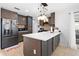 Spacious kitchen with an island, stylish lighting, and plenty of cabinet space at 11318 Stoneybrook Path, Port Richey, FL 34668